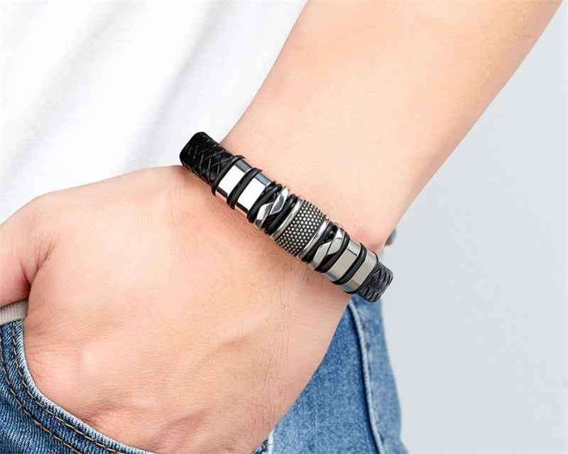 ForgeWeave steel-tone clasp bracelet worn on a wrist beside a white shirt cuff and blue jeans