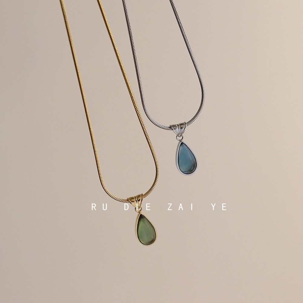 DewLume green and blue teardrop necklaces shown together