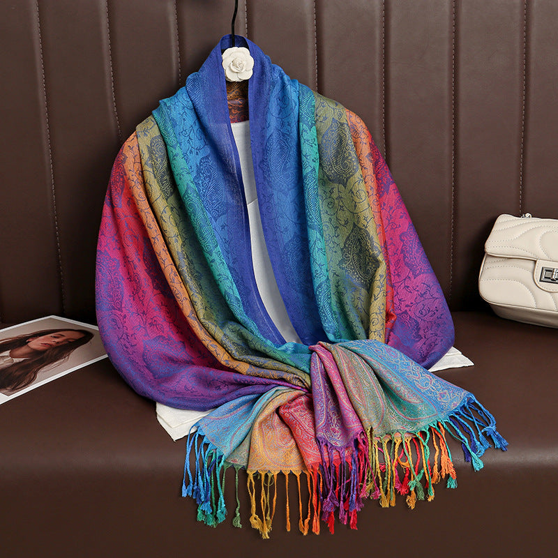 HueWrap blue, green and purple paisley scarf draped on a hanger