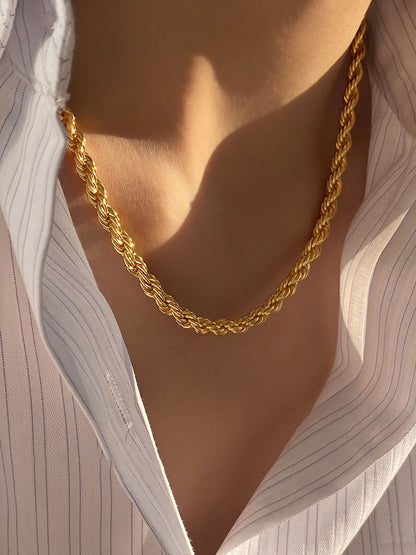 AuriTwist Signature Gold — Bold rope chain styled with a white pinstriped shirt