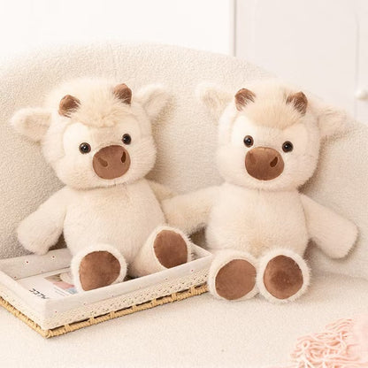 Two cream Highland cow plush toys displayed together; each CreamCuddle order includes one plush